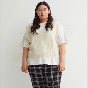 Double-knit sweater vest with a V-neck and ribbing at neckline,armholes and hem.